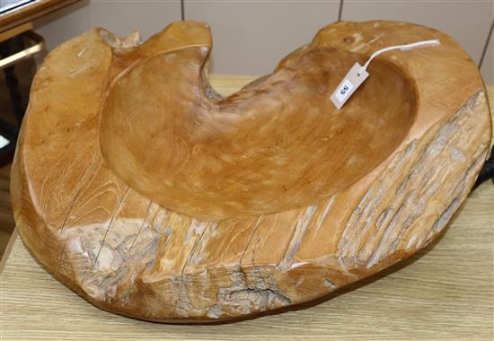A large carved elm bowl length 63cm